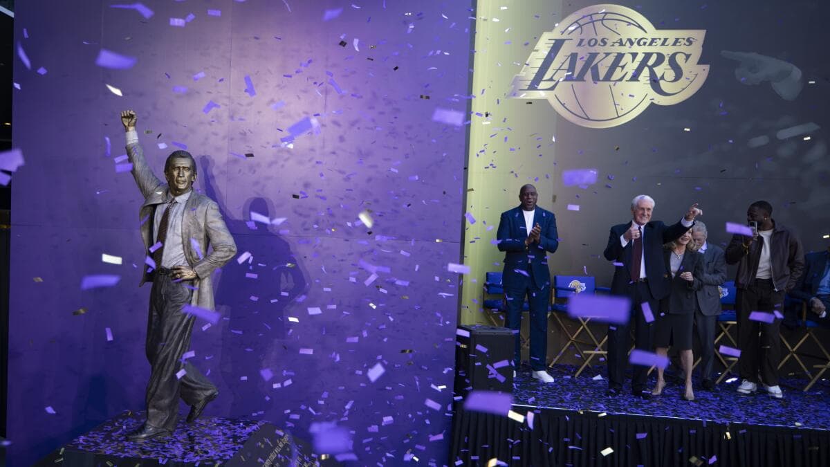 A bronze statue of Pat Riley outside Crypto.com Arena depicting him in a coaching stance during the Lakers’ Showtime era.