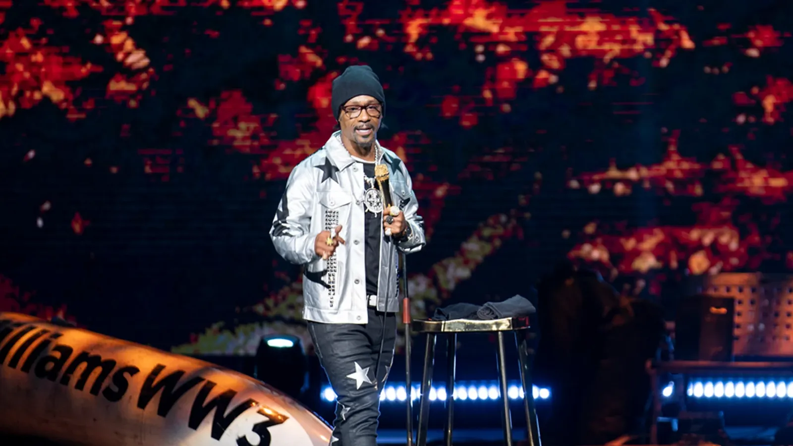 Katt Williams performing on stage with a microphone