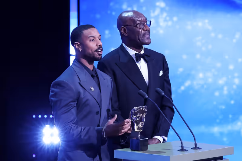 Stage lighting and presenters at the BAFTA Awards ceremony.