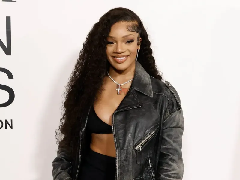 Rapper GloRilla posing on the red carpet at a music industry event