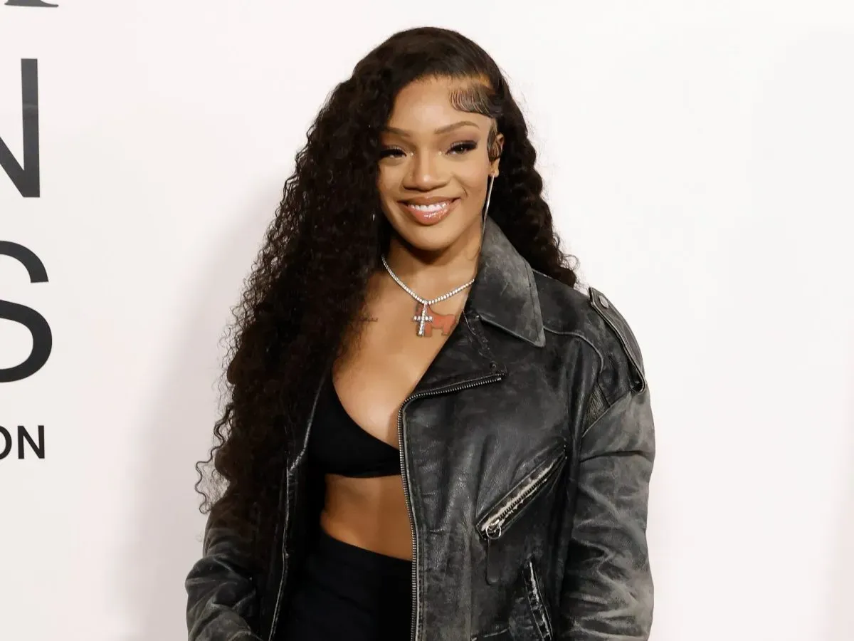 Rapper GloRilla posing on the red carpet at a music industry event