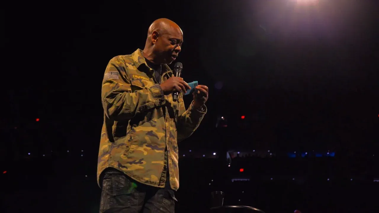 Dave Chappelle on stage performing in his Netflix special “The Unstoppable”